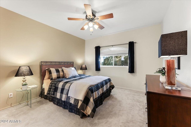 bedroom with ceiling fan and light colored carpet