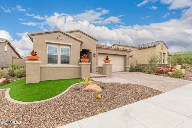 mediterranean / spanish-style house featuring a garage