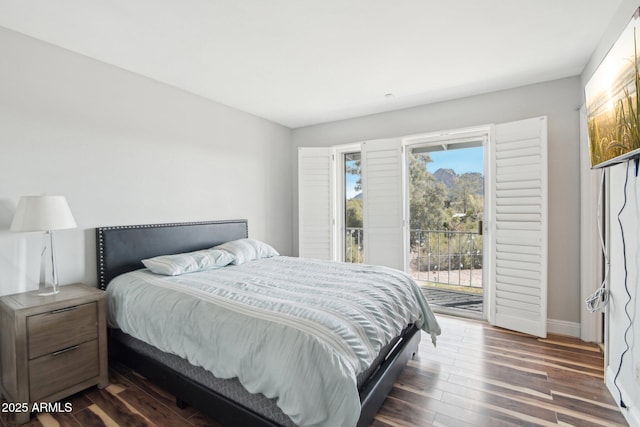 bedroom with dark hardwood / wood-style flooring and access to outside