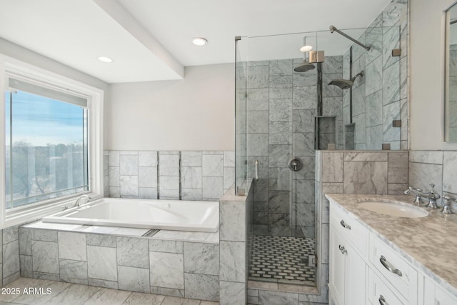 bathroom with vanity, independent shower and bath, and tile walls