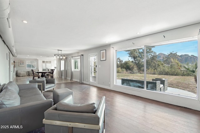 living room featuring hardwood / wood-style flooring and a notable chandelier