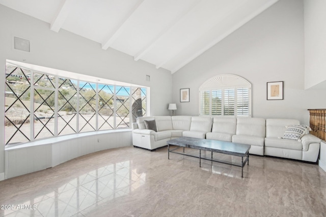 living room featuring beam ceiling and high vaulted ceiling