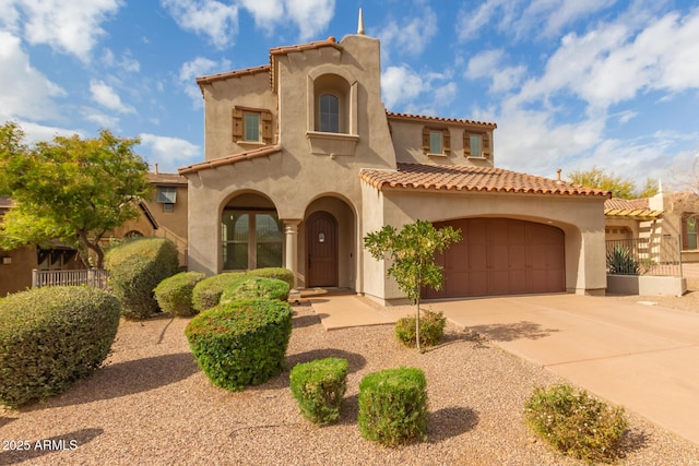 mediterranean / spanish house featuring a garage