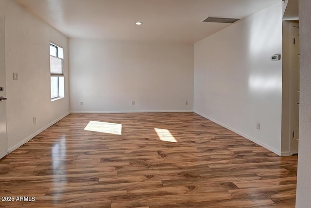 empty room featuring hardwood / wood-style floors