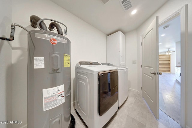 laundry area with visible vents, water heater, recessed lighting, cabinet space, and washer and dryer