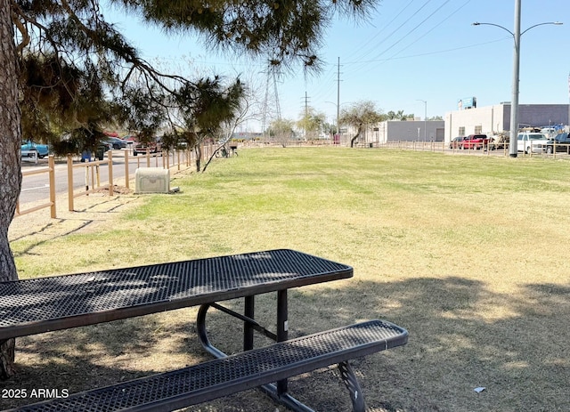 view of home's community with a lawn