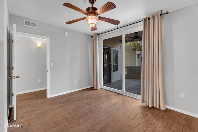 1825 W Ray Rd Unit 1119, Chandler, AZ 85224 - spare room with a ceiling fan, wood finished floors, and baseboards