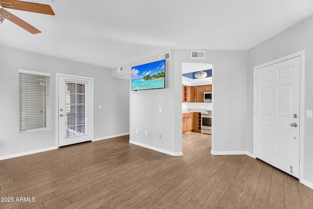 1825 W Ray Rd Unit 1119, Chandler, AZ 85224 - unfurnished living room featuring wood finished floors, a ceiling fan, and baseboards