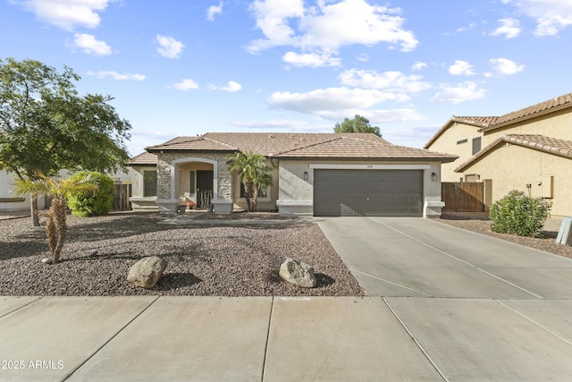 15969 W Adams St, Goodyear, AZ 85338 - view of front of home with a garage, stucco siding, driveway, and a tile roof