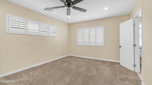 unfurnished room with ceiling fan, carpet floors, baseboards, visible vents, and recessed lighting