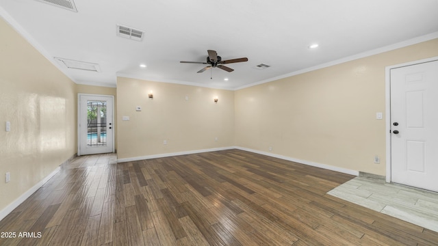 unfurnished living room with wood finished floors, visible vents, and a ceiling fan