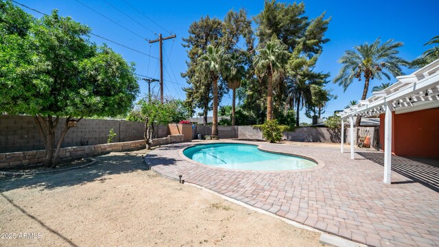 view of swimming pool with a fenced backyard, a pergola, a patio area, and a fenced in pool