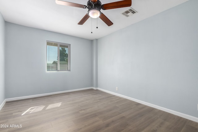 unfurnished room featuring light hardwood / wood-style flooring and ceiling fan