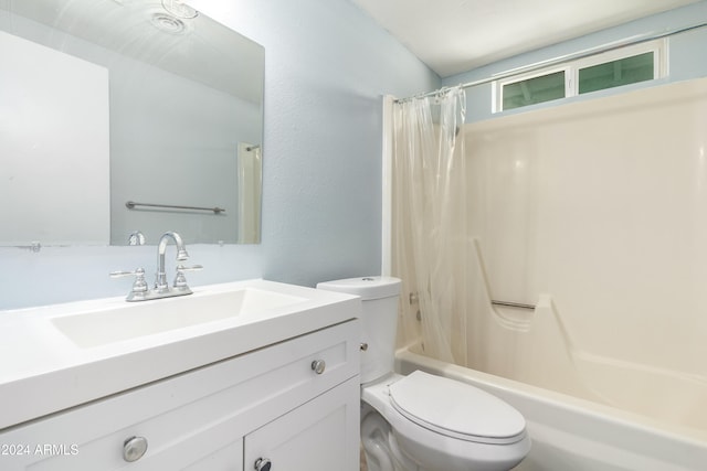 full bathroom featuring vanity, toilet, and shower / tub combo with curtain