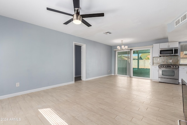 unfurnished living room with light hardwood / wood-style floors and ceiling fan with notable chandelier