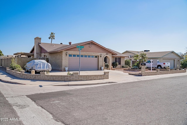 ranch-style house featuring a garage