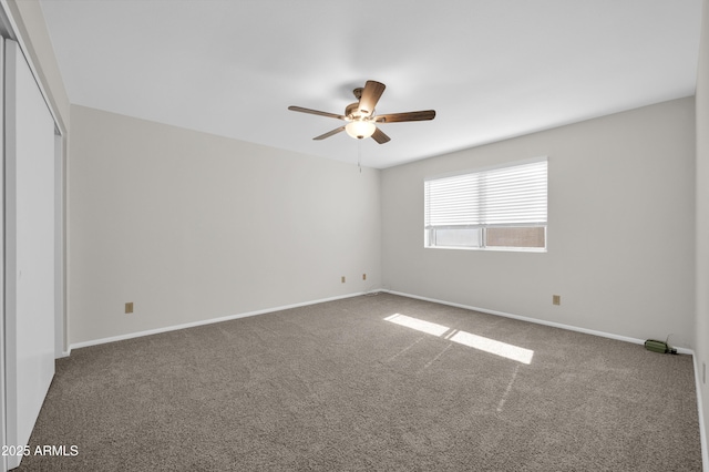 carpeted empty room with ceiling fan