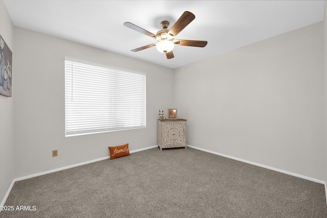 carpeted empty room featuring ceiling fan