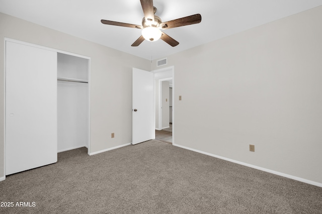 unfurnished bedroom with a closet, ceiling fan, and carpet