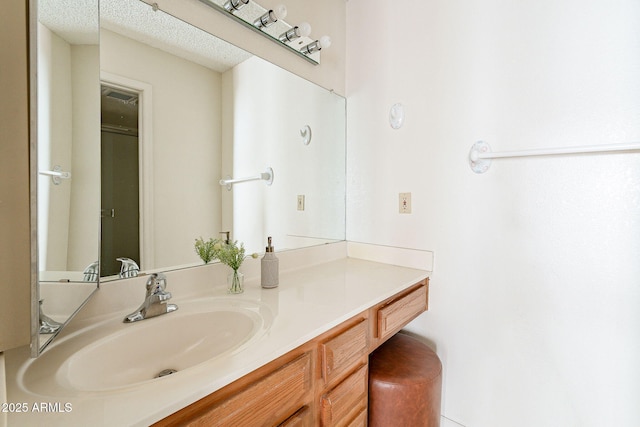 bathroom featuring vanity and a textured ceiling