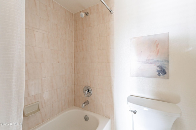 bathroom with toilet and washtub / shower combination