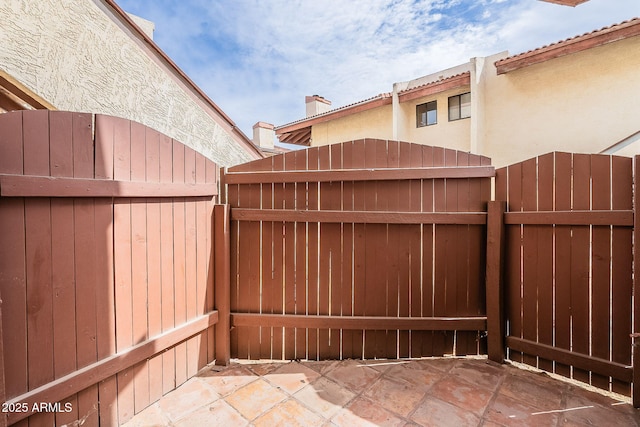 view of patio / terrace featuring fence