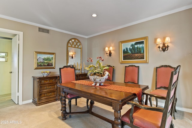 dining space featuring light carpet and ornamental molding