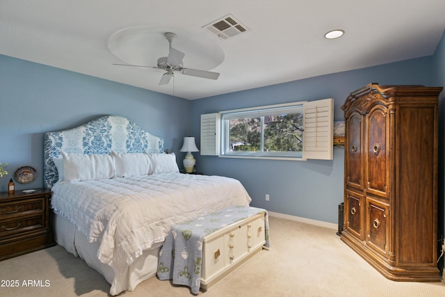 bedroom with ceiling fan and light colored carpet