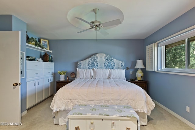 bedroom with ceiling fan and light colored carpet