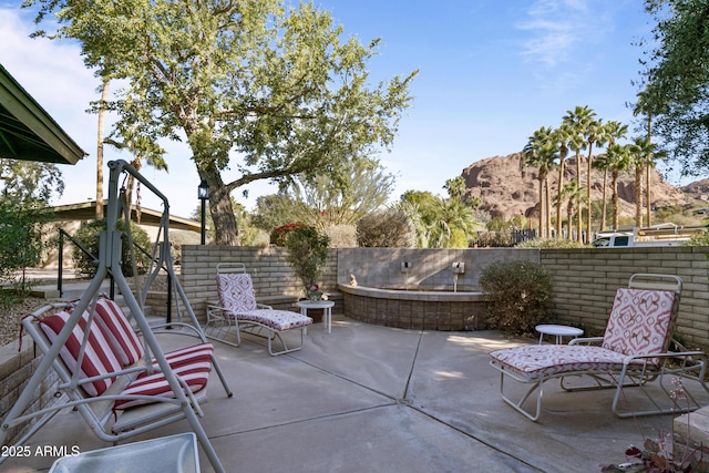 view of patio / terrace with a mountain view