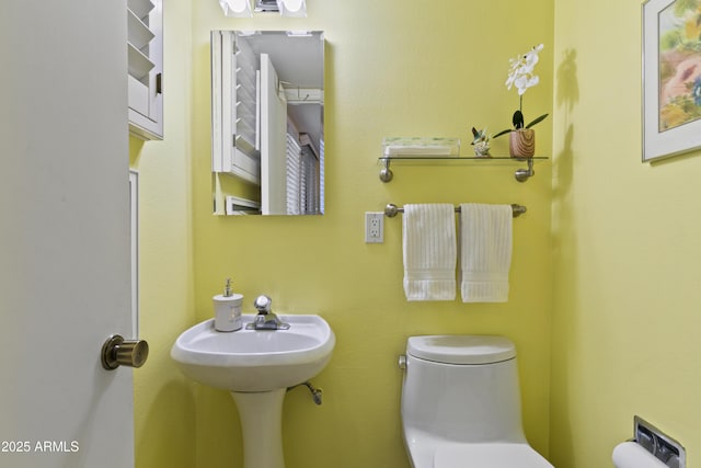 bathroom with toilet and sink