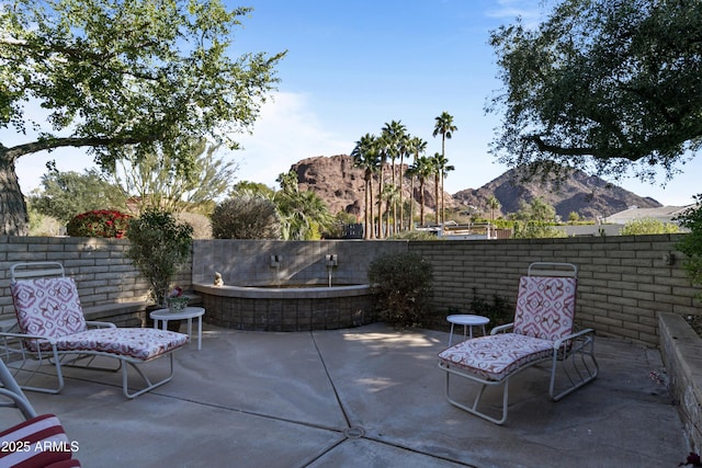 view of patio with a mountain view