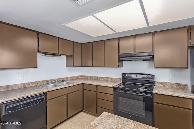 kitchen featuring sink, black appliances, and light tile patterned floors