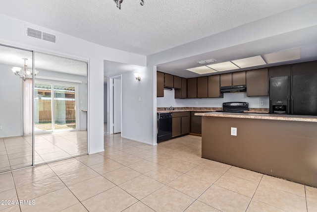 kitchen featuring sink, black appliances, dark brown cabinetry, an inviting chandelier, and light tile patterned floors