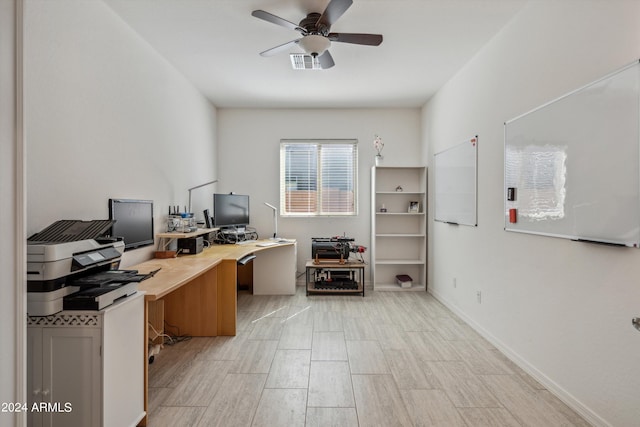 office with ceiling fan and light hardwood / wood-style floors