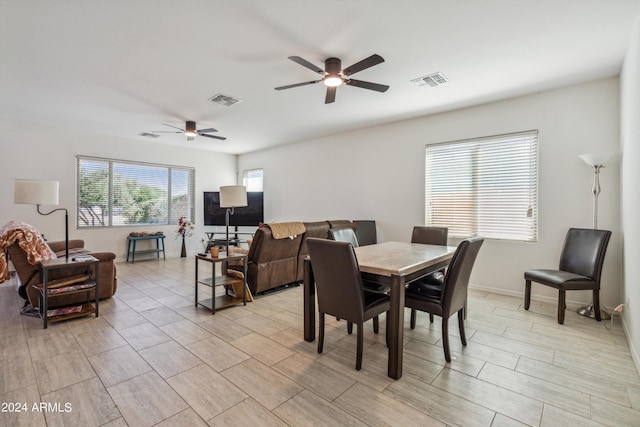 dining space with ceiling fan