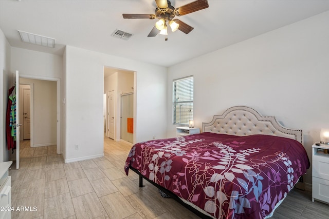 bedroom with ceiling fan and light hardwood / wood-style floors