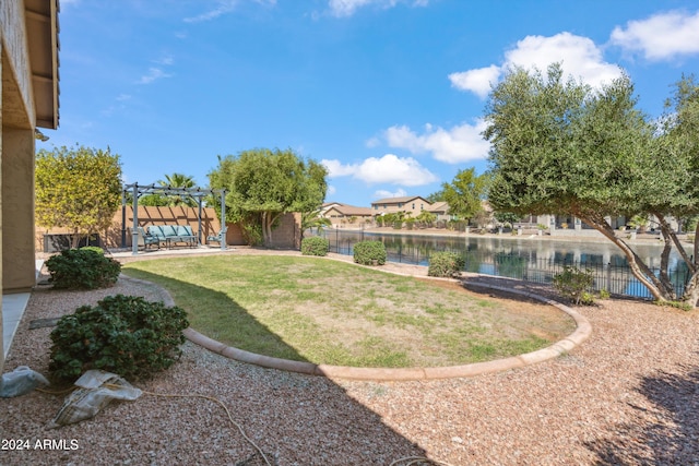 view of yard featuring a patio and a water view