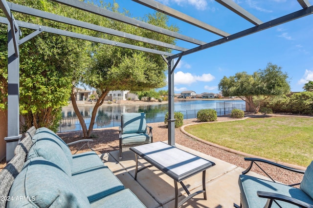 view of patio featuring a pergola and a water view