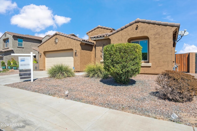 view of front of property featuring a garage