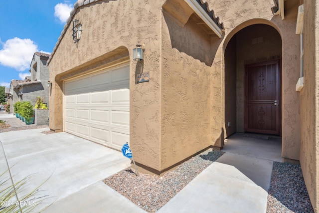 entrance to property featuring a garage