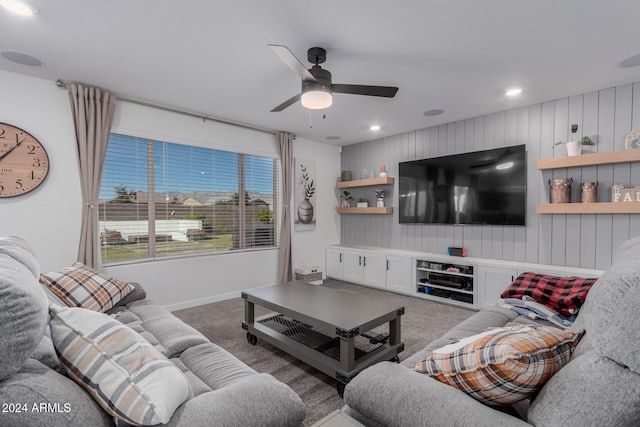 living room featuring carpet and ceiling fan