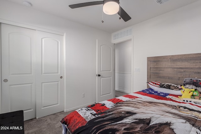 carpeted bedroom featuring ceiling fan and a closet