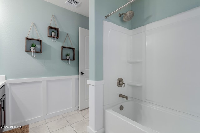 bathroom featuring tile patterned flooring, vanity, and shower / washtub combination