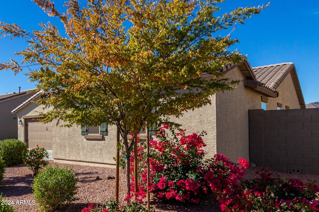 view of side of property with a garage