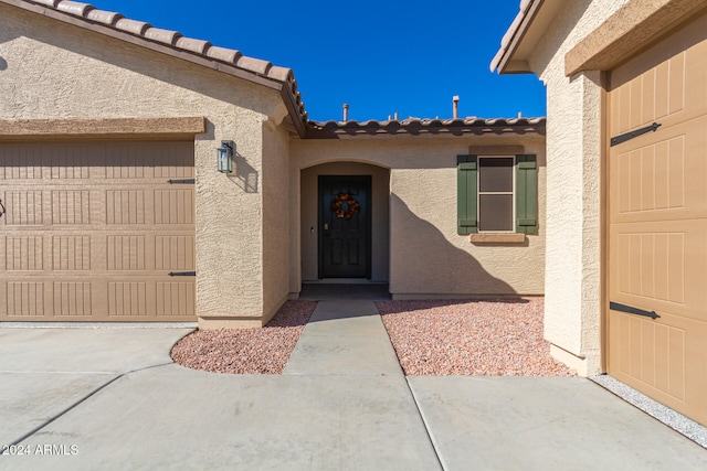 doorway to property featuring a garage