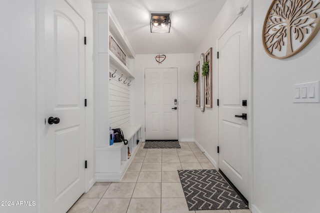 mudroom with light tile patterned floors