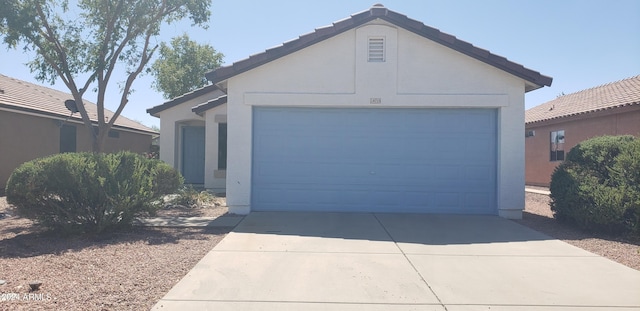 ranch-style home with a garage