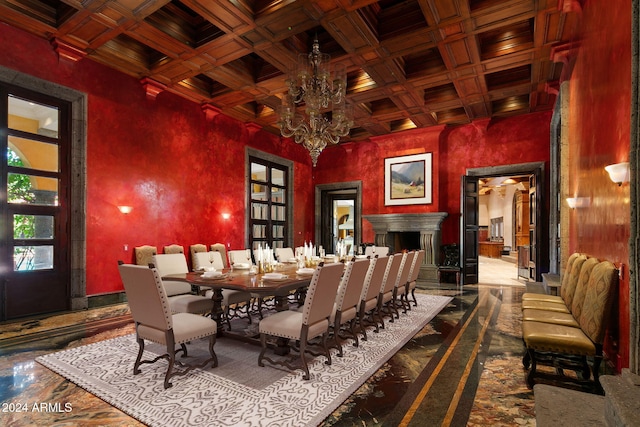 dining room featuring coffered ceiling, an inviting chandelier, and beam ceiling