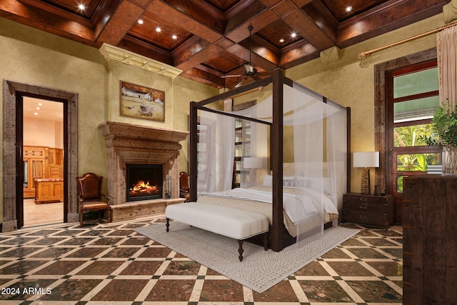 8100 N 68th St, Paradise Valley, AZ 85253 - bedroom featuring coffered ceiling, a lit fireplace, beamed ceiling, recessed lighting, and crown molding
